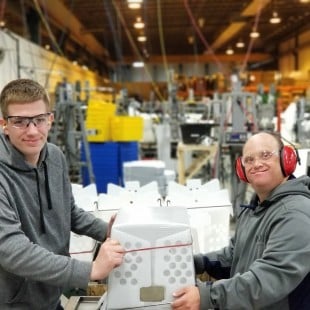 disabled warehouse workers on assembly line