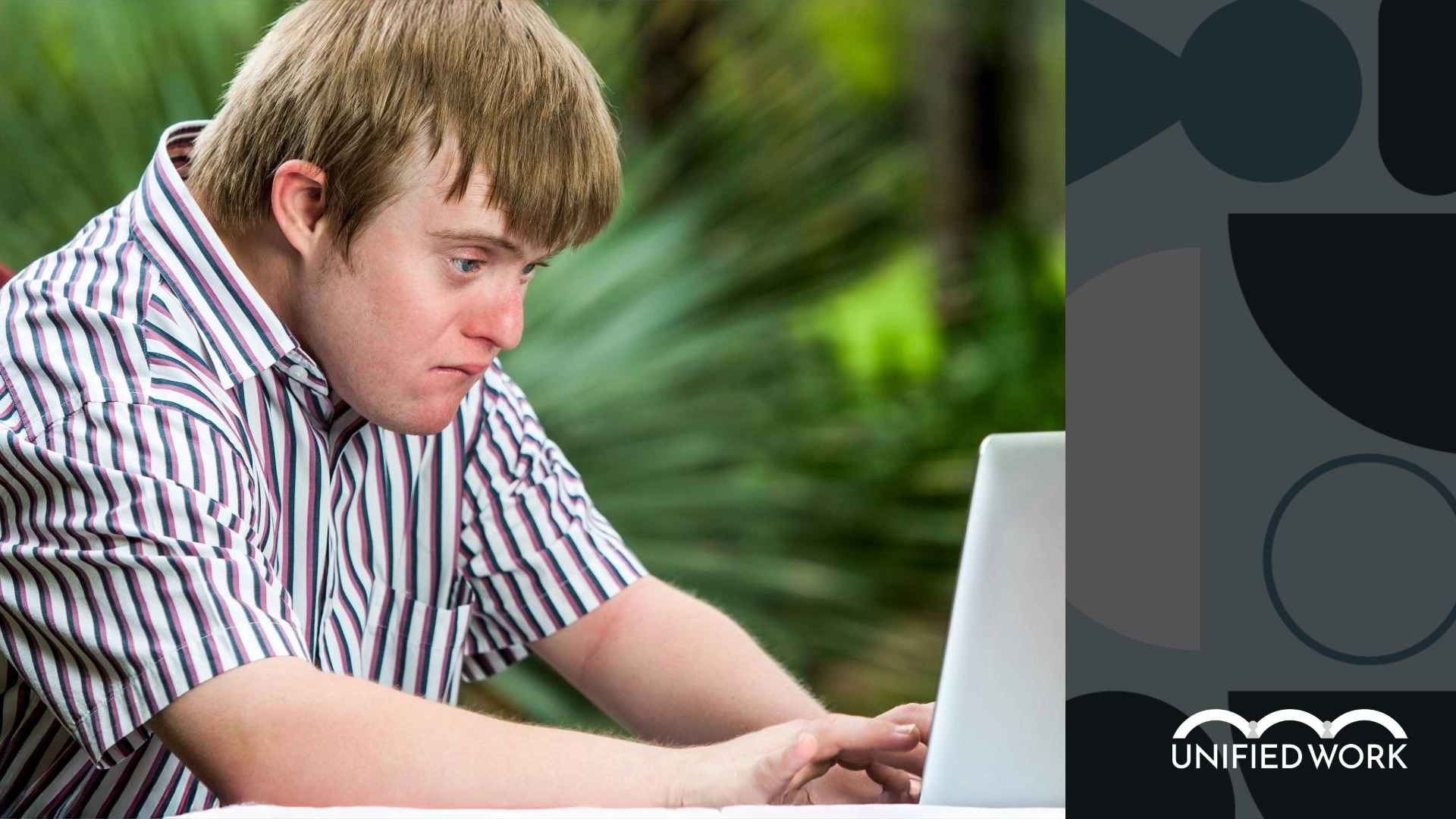 young man with disability studying on his laptop with Unified Work academy soft skill training